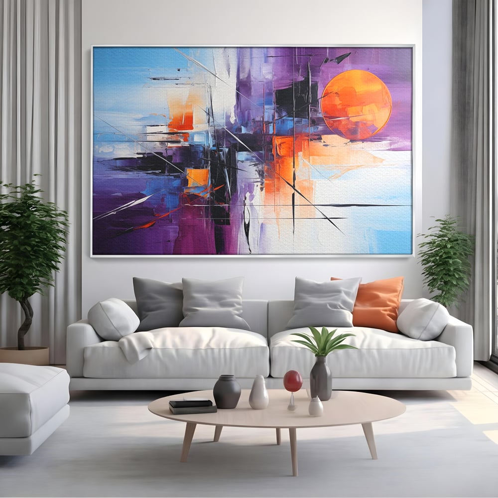 Tablou canvas cu pictura abstracta cu soare portocaliu, in rama de aluminiu argintiu, pe perete intr-un living
